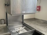 an image of a kitchen with a washer and dryer