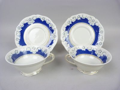 pair of blue and white porcelain dishes with gold trim