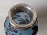 a small vase with a blue and purple design on it