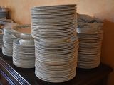 many plates stacked on top of each other on a table