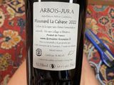 a bottle of wine that is being held by a person