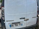 a white van that is parked on the side of the road