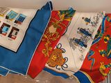 a pile of cloths sitting on a shelf next to a book shelf