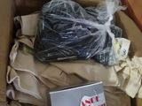 a box full of clothes and a laptop in it