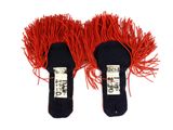 pair of black and red shoes with red fringes on them