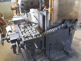 a machine that is sitting on a table in a garage