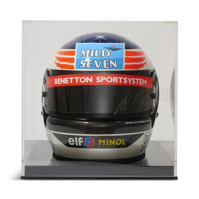 a helmet on display in a clear display case