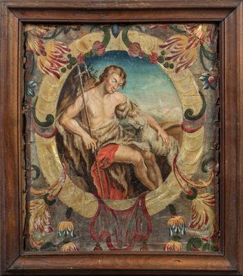un tableau représentant un homme tenant un mouton, dans un cadre en bois