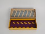 a yellow box with a purple and yellow pattern inside of it