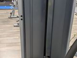a gym machine with a plant in the middle of it
