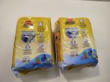 two bags of fish food sitting on top of a counter