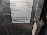 a sign on the side of a refrigerator that says mooshkani ice maker