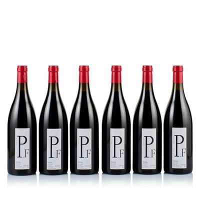 six bottles of red wine lined up in a row