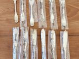 a lot of forks and spoons that are wrapped in plastic