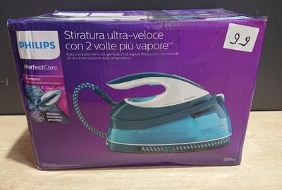 La boîte du fer à repasser à vapeur Philips Ultra-Voice est posée sur la table.