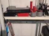 a shelf that has a bunch of tools on it