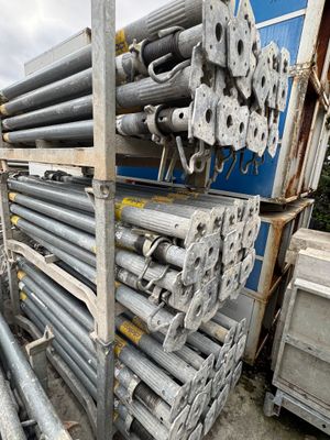 a large pile of steel pipes stacked on top of each other