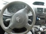 dashboard of a car with a steering wheel and dashboard controls