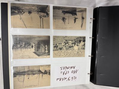 a black book with pictures of people on it and writing on the pages