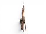 a wooden pole with a bunch of sticks attached to it