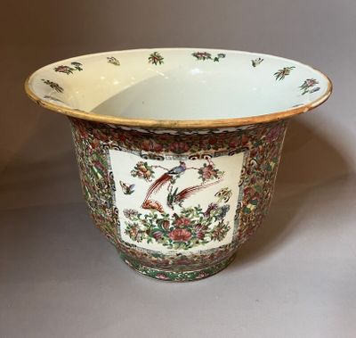 a white bowl with a bird and flowers design on it