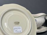a plate with a saucer on it and a saucer on the side