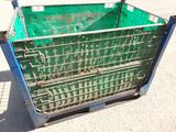 a green crate that is sitting on the ground