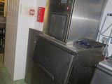 a kitchen with a refrigerator, stove, and sink