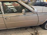 a car that is parked in a garage with its hood open