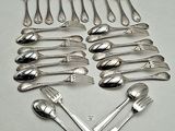 a lot of spoons and forks arranged in a heart shape