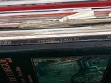 a lot of records stacked on top of each other