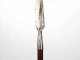 a close up of a knife on a wooden stick