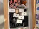 a closet full of shoes and other items in it
