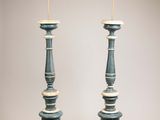 pair of blue and white lamps on a table with a white background