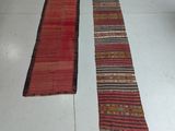 two rugs that are on the floor in a room