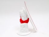 a figurine of a man holding a surfboard on a white surface