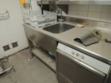 a kitchen with a sink, dishwasher, and dishwasher in it