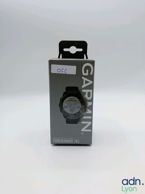a box with a watch inside of it on a white surface