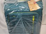 a piece of luggage wrapped in plastic on a white surface