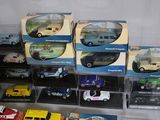a lot of toy cars on display in a case