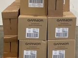 several boxes of garnier are stacked on a pallet in a warehouse