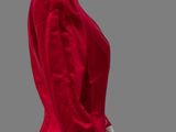 the mannequin is wearing a red jacket and black pants