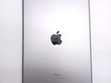 an apple ipad sitting on top of a white table next to a wall
