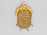 a gold mesh purse with a chain around it