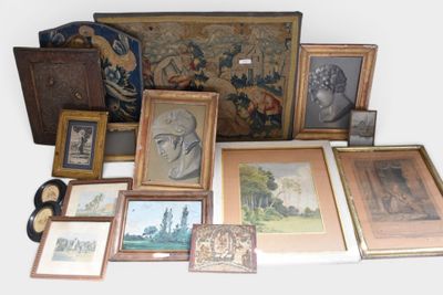 a lot of framed pictures and pictures on the floor