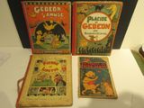 trois livres pour enfants exposés sur une table dans un musée