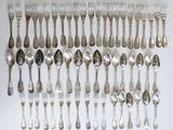 a lot of silver spoons and forks on the table