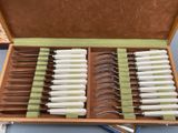 a suitcase with a bunch of knives inside of it