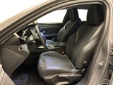 the interior of a car with the door open showing the driver ' s seat area