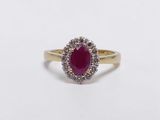 an oval ruby and diamond ring